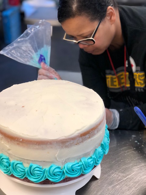Decorating a cake First layer of rosettes!