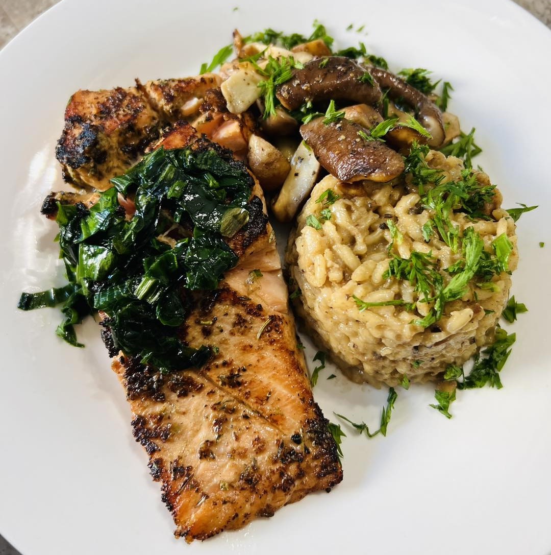 Salmon fillet with risotto, mushrooms, and ramps